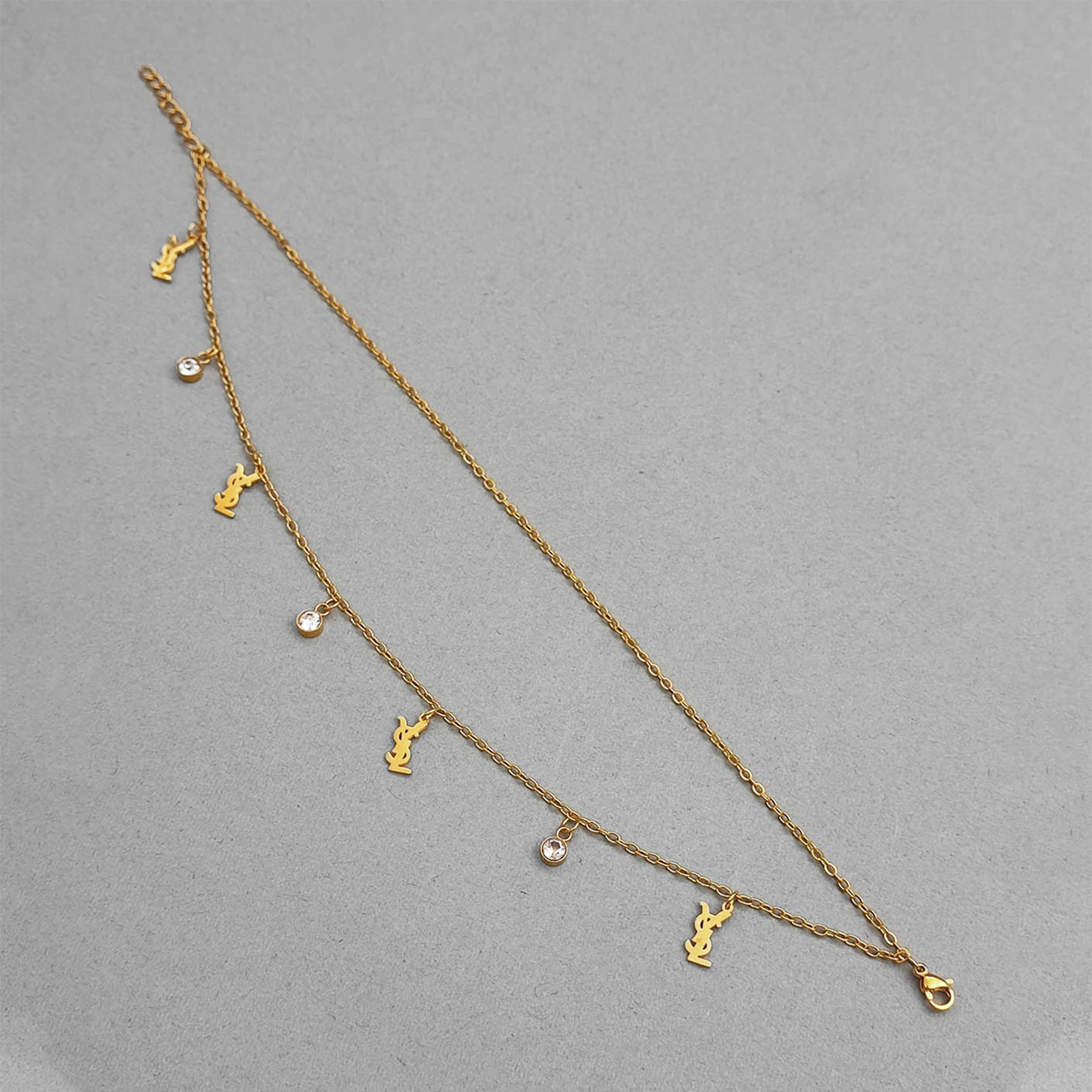 پابند طلایی استیل با طرح YSL