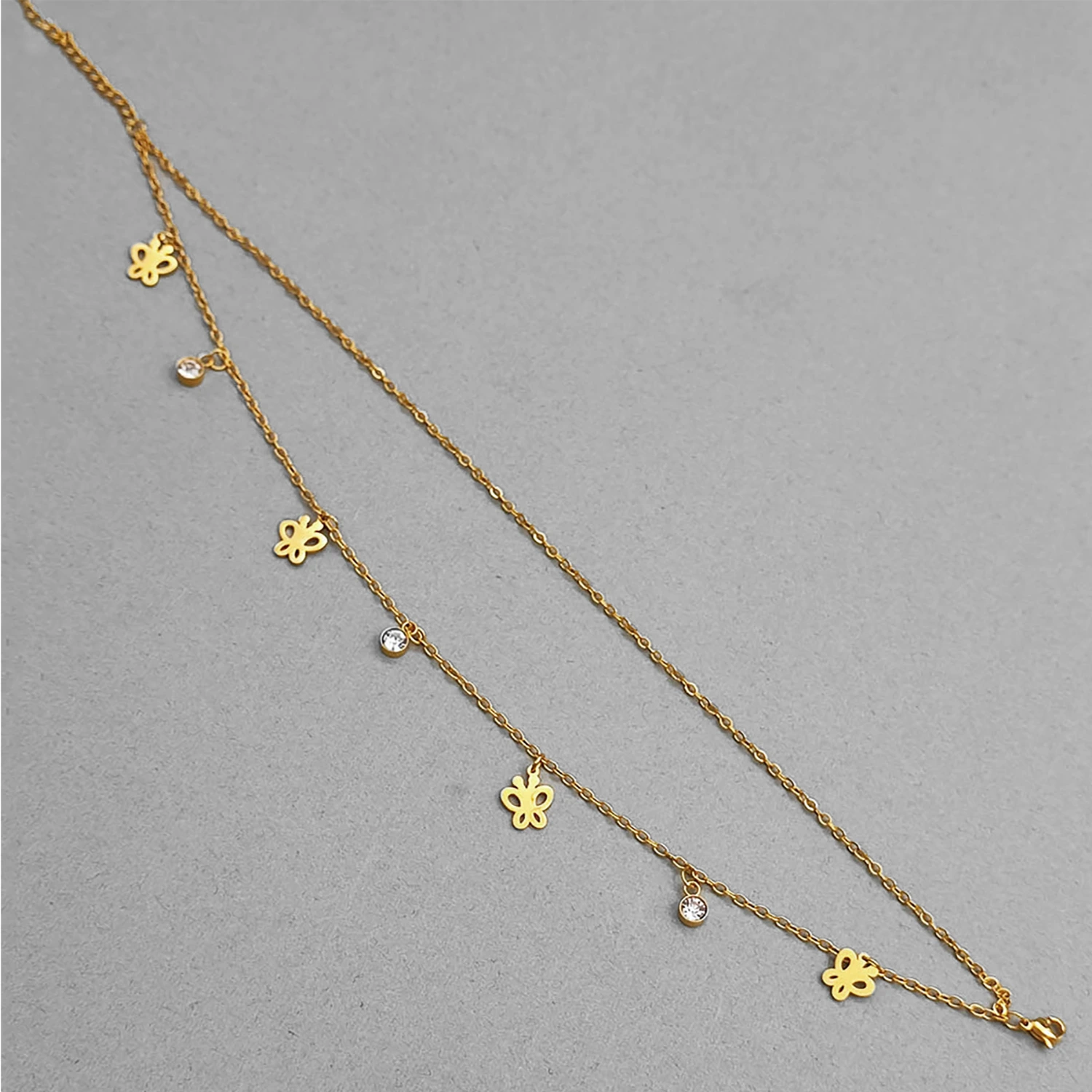 پابند آویز استیل با طرح پروانه