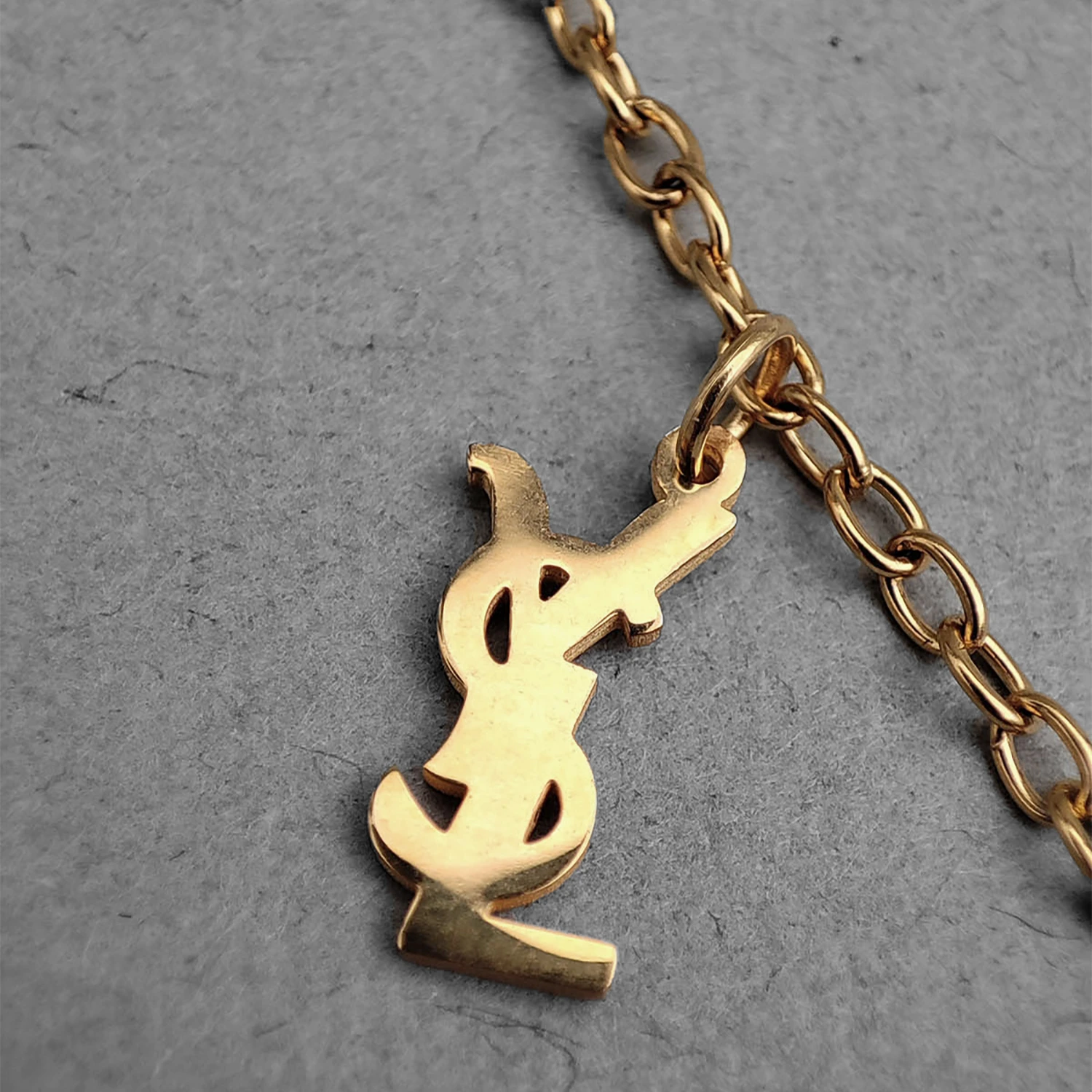 پابند طلایی استیل با طرح YSL